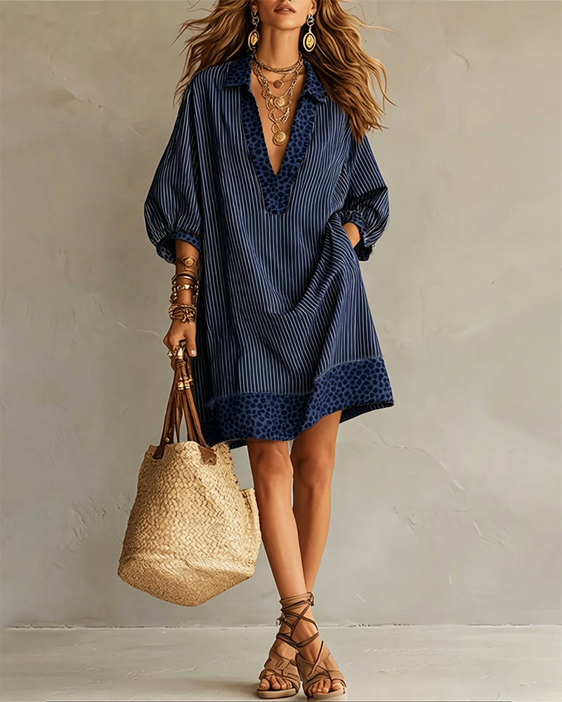 Vestido con paneles estampados de leopardo, mangas abullonadas y camisa a rayas.