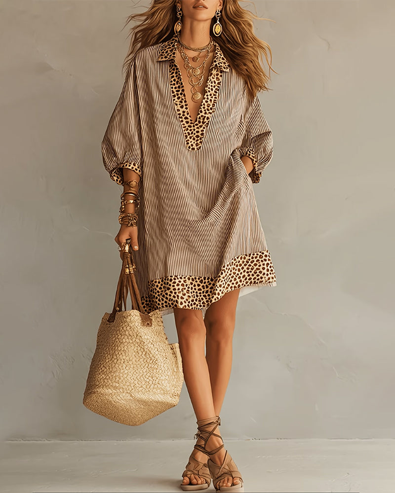 Vestido con paneles estampados de leopardo, mangas abullonadas y camisa a rayas.