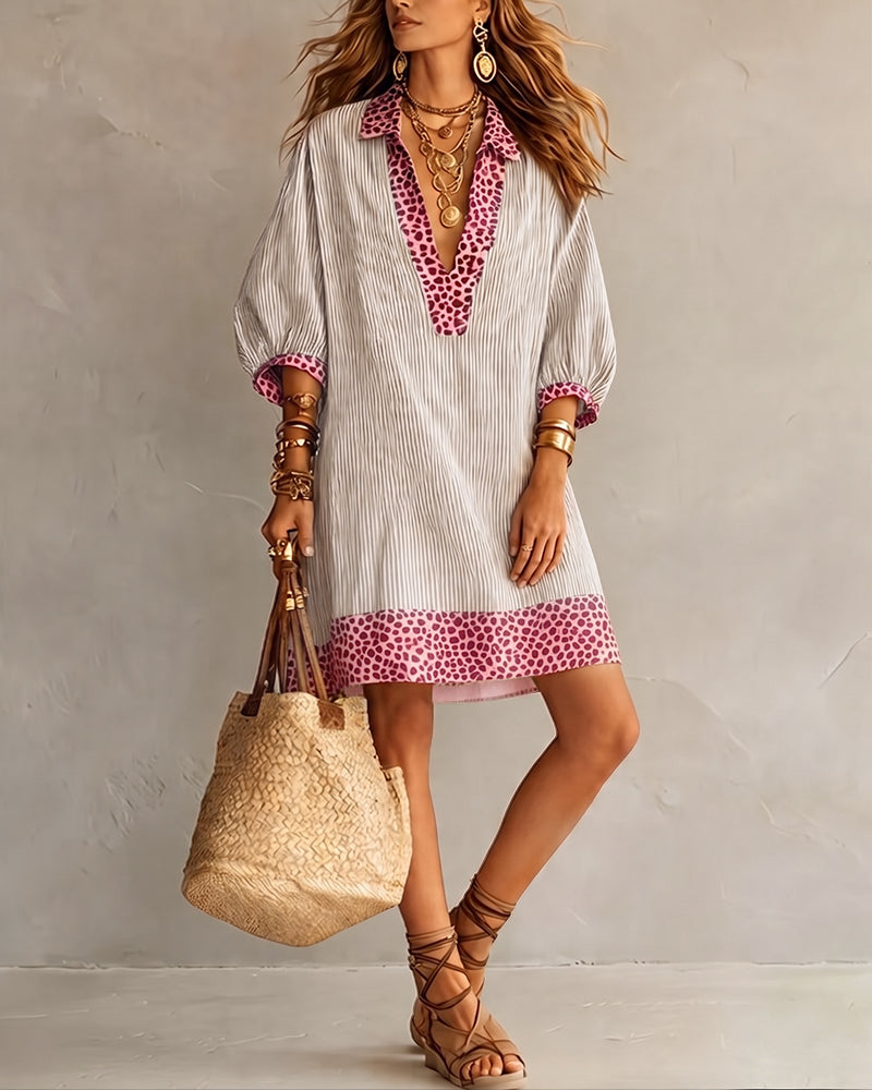 Vestido con paneles estampados de leopardo, mangas abullonadas y camisa a rayas.