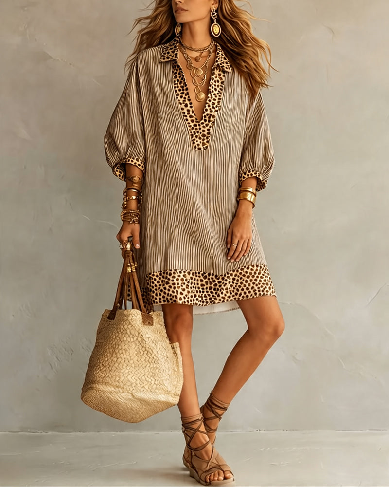Vestido con paneles estampados de leopardo, mangas abullonadas y camisa a rayas.
